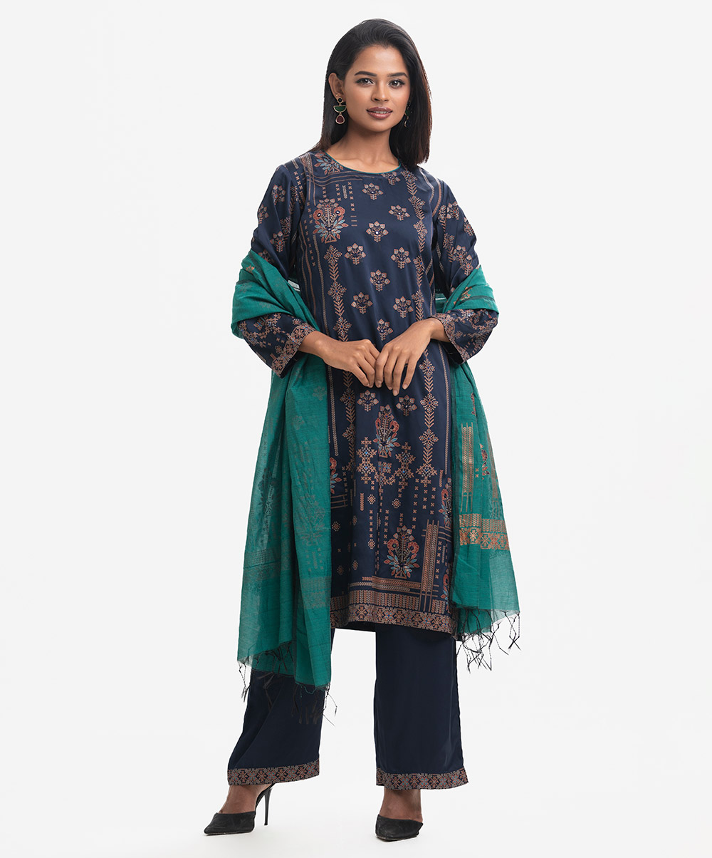 Round neck, full-sleeved A-line kameez in satin-georgette fabric with karchupi. Complemented with an elasticated waist palazzo and a matching half-silk dupatta. Karchupi detailed. Blue Georgette Salwar Kameez
