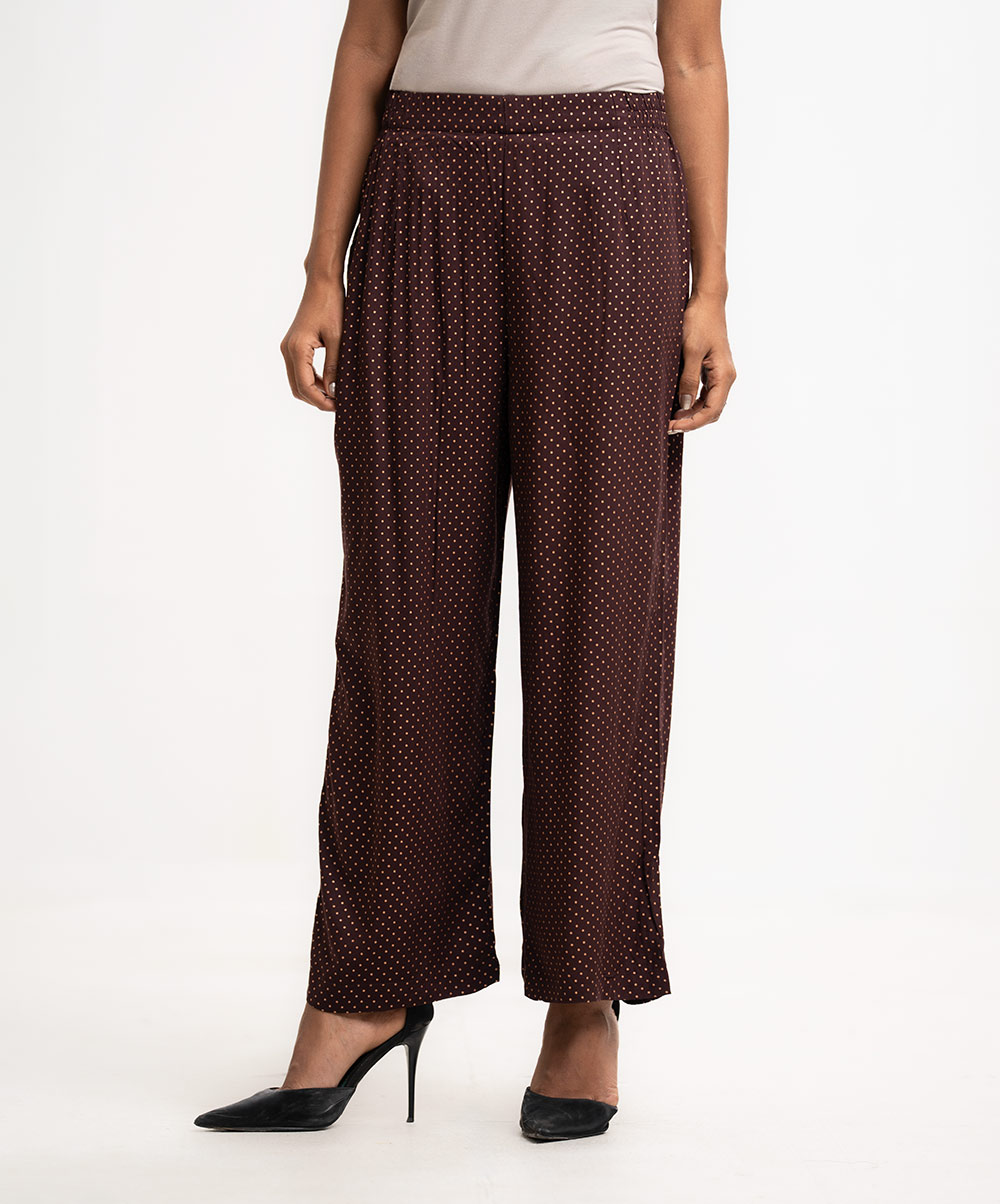 Women's regular polka dot printed palazzo in viscose fabric. Concealed elasticated waistline. Coffee Viscose Palazzo